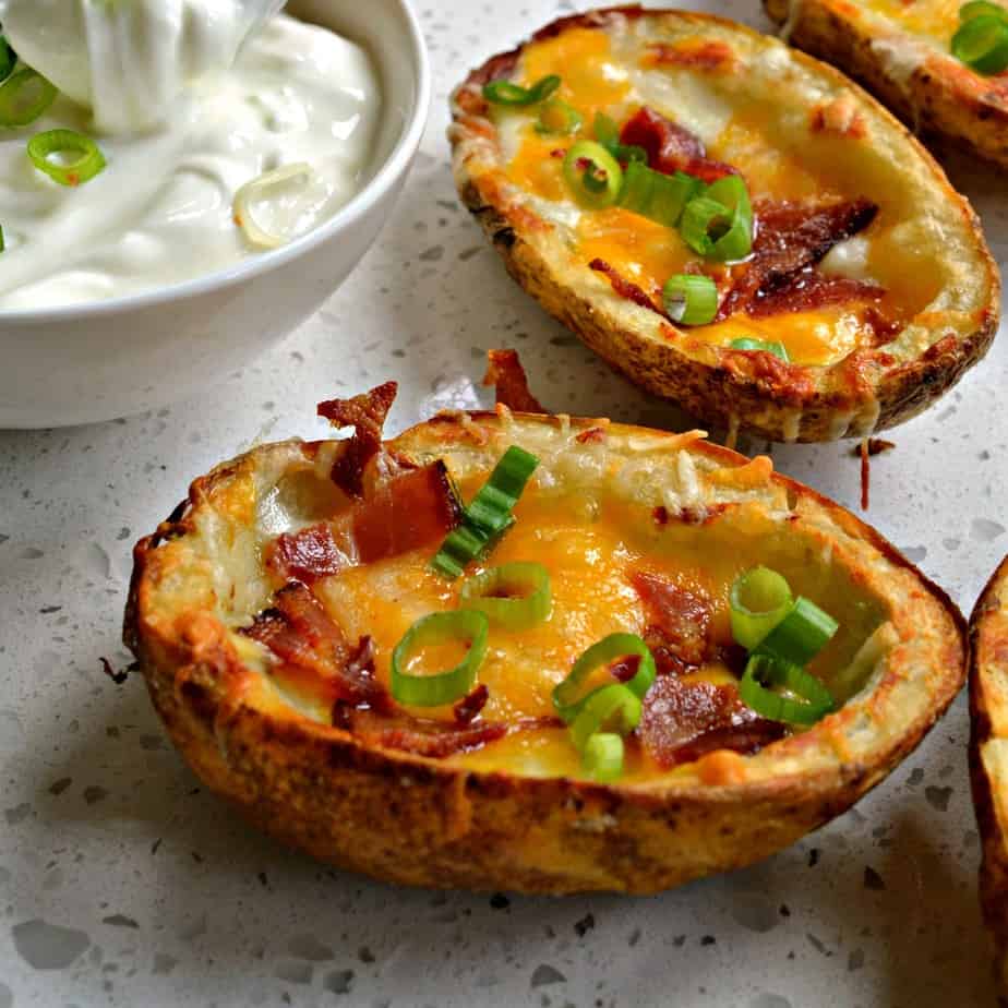 Family friendly potato skins are quick to come together and delectable.
