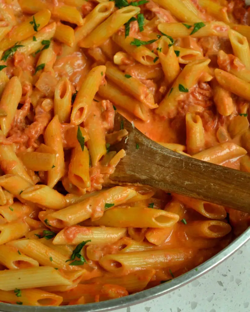 Penne alla Vodka is pasta in a rich creamy slightly tangy tomato sauce with garlic, onions, crushed tomatoes and vodka.