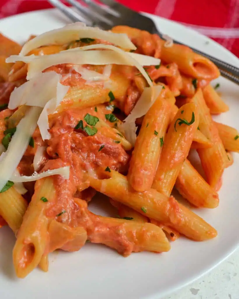 Penne alla Vodka is pasta in a rich creamy slightly tangy tomato sauce with garlic, onions, crushed tomatoes and vodka.