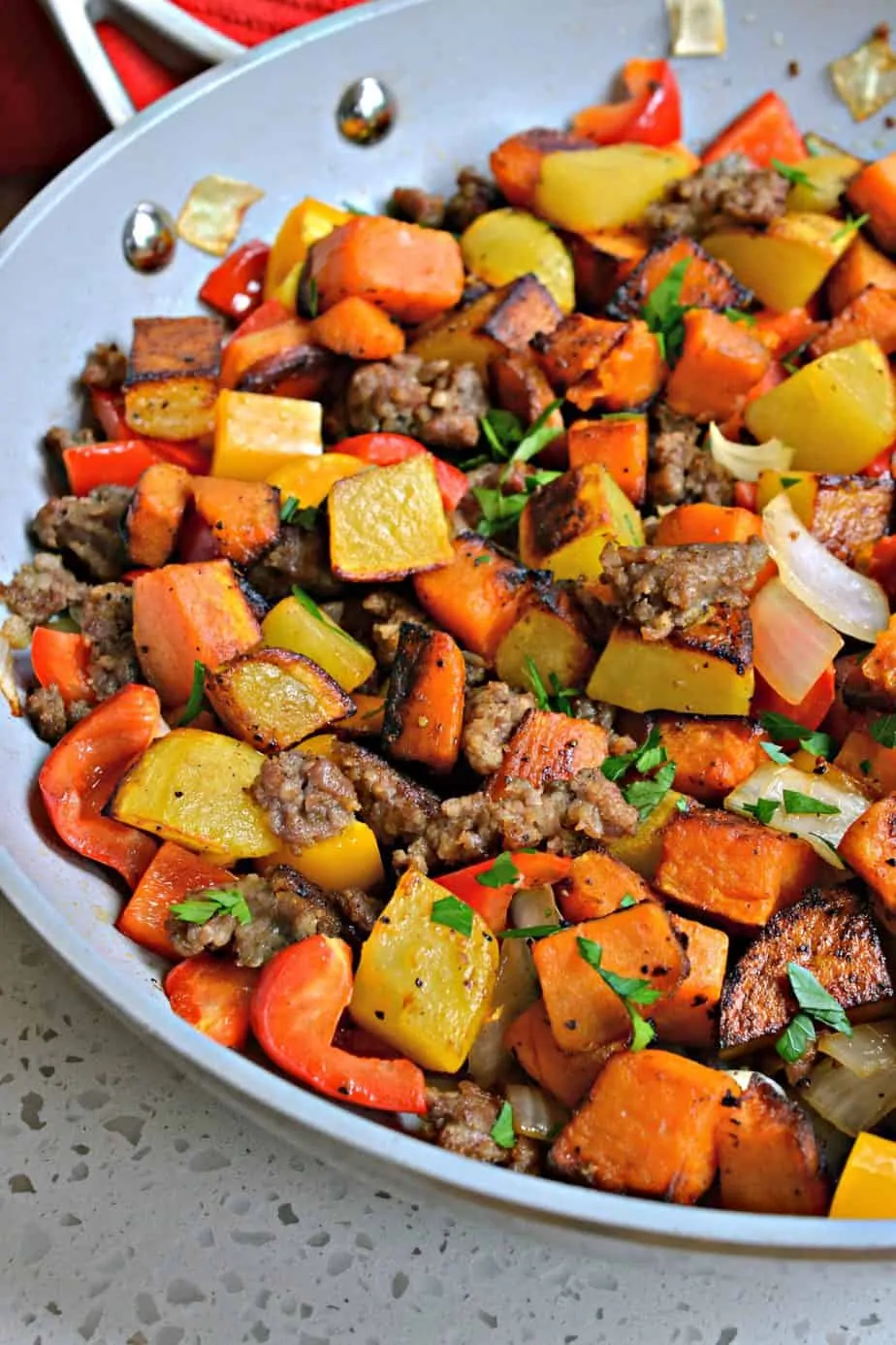 This hearty Sweet Potato hash has both sweet potatoes and gold potatoes, along with onions, bell peppers, and pork sausage. 