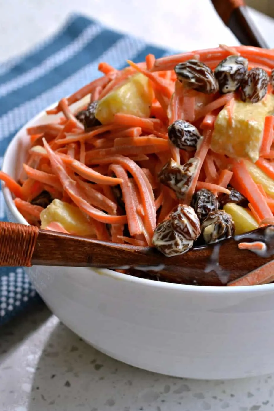 This fresh Carrot Salad is lightly sweetened with all natural honey and freckled with plump raisins and crisp pineapple. 