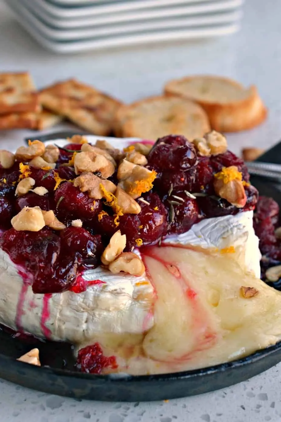 This Baked Brie with cranberries, walnuts, rosemary and honey is easy, elegant and flavorful. 
