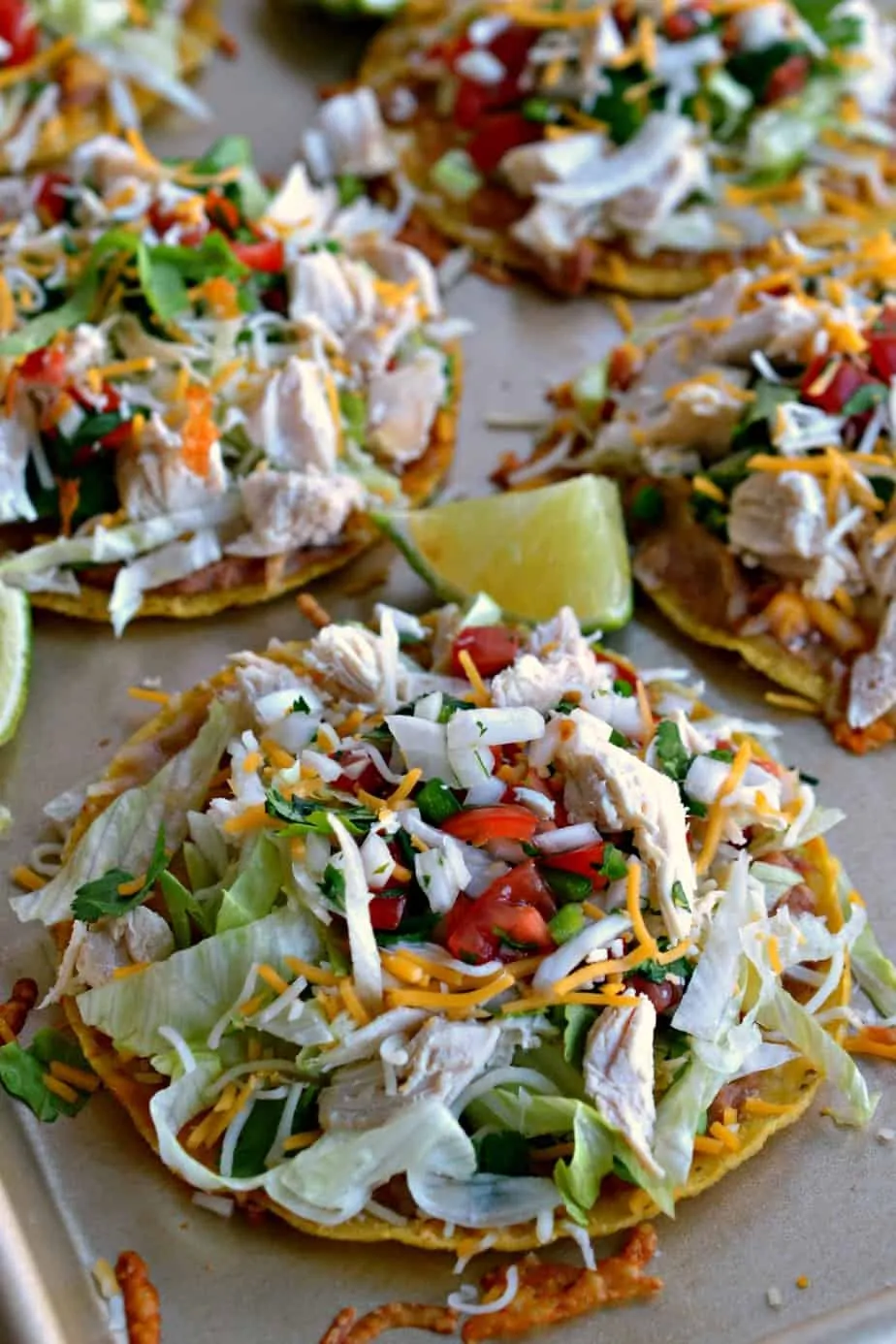 A five ingredient Pico de Gallo, refried beans, and Mexican Blend cheese take these chicken tostadas to the next level.  