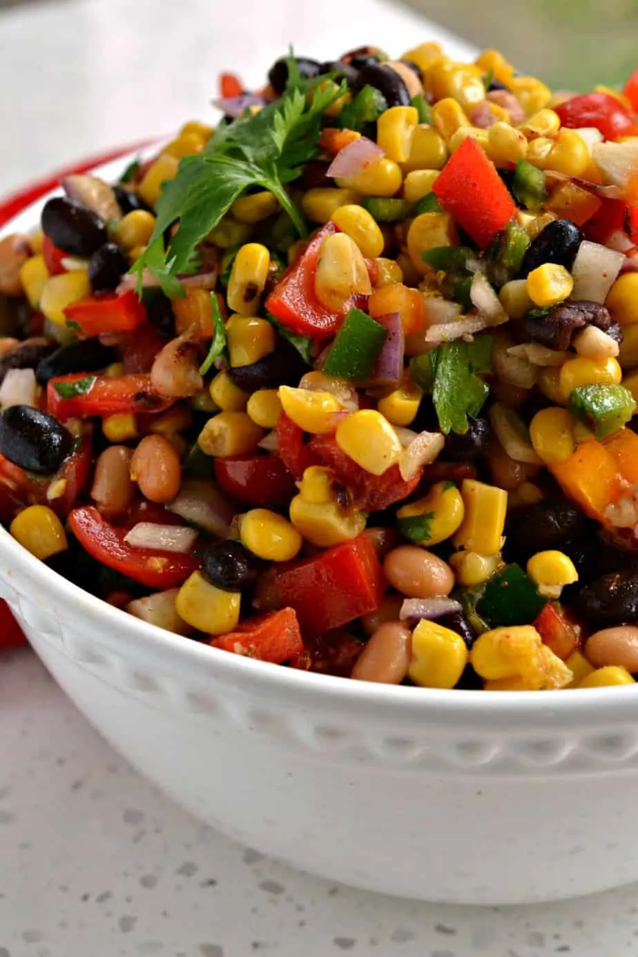 this bean salad is the perfect anytime snack for picnics, potlucks, reunions, and barbecues. Make a big batch because everyone loves it!