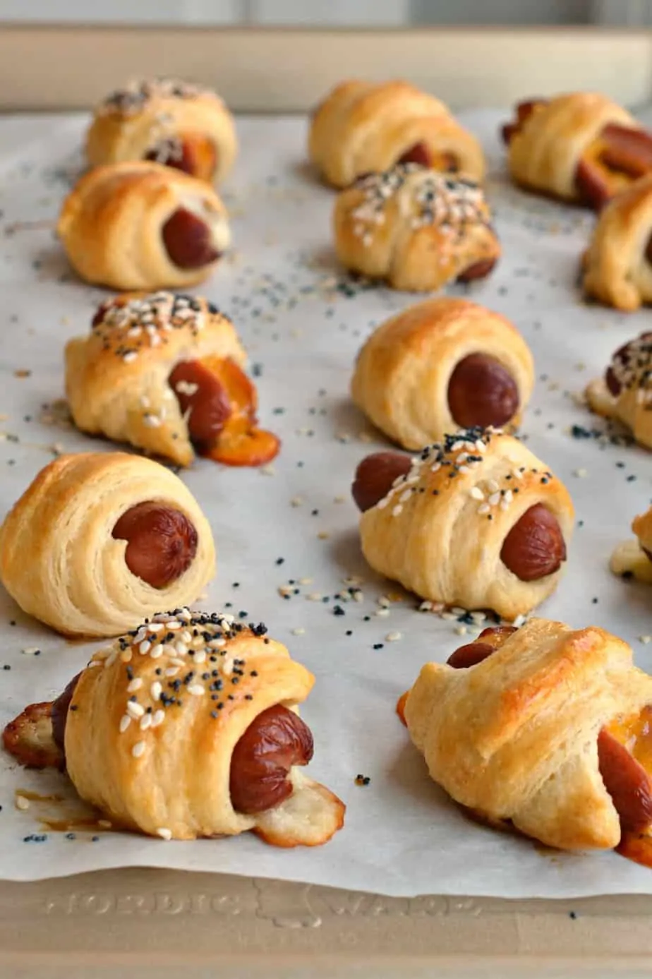 Mini Pigs in a blanket are one of the easiest comfort foods to make using a variety of cheese and refrigerated crescent rolls. 