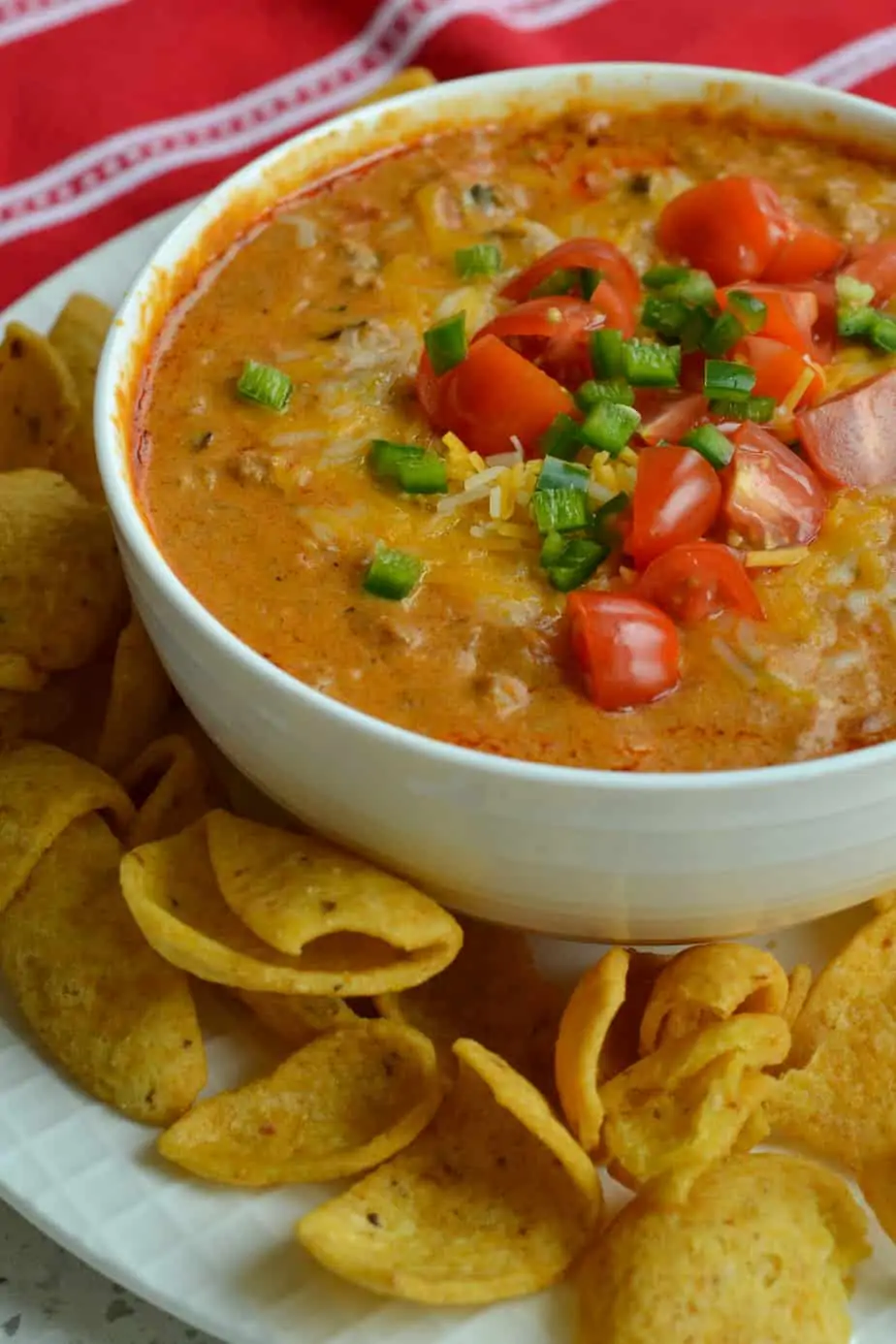 Chili Cheese Dip is a blend of thick chili. salsa style tomatoes, cream cheese, hot sauce, cheddar and Pepper Jack cheese. 