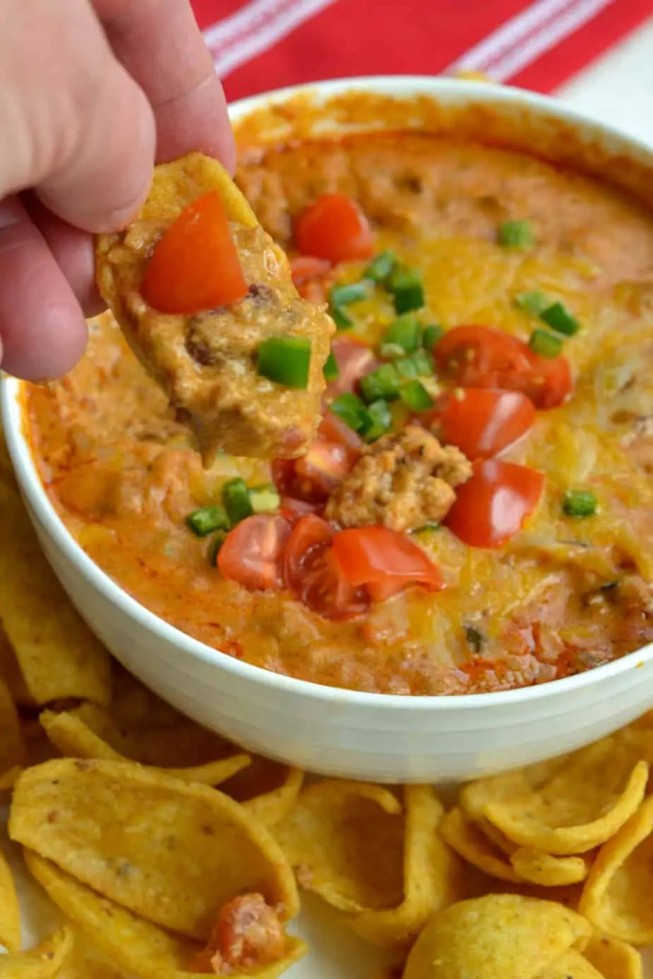 This six ingredient hot Chili Cheese Dip takes less than 15 minutes to make and can easily be adapted to a crock pot.