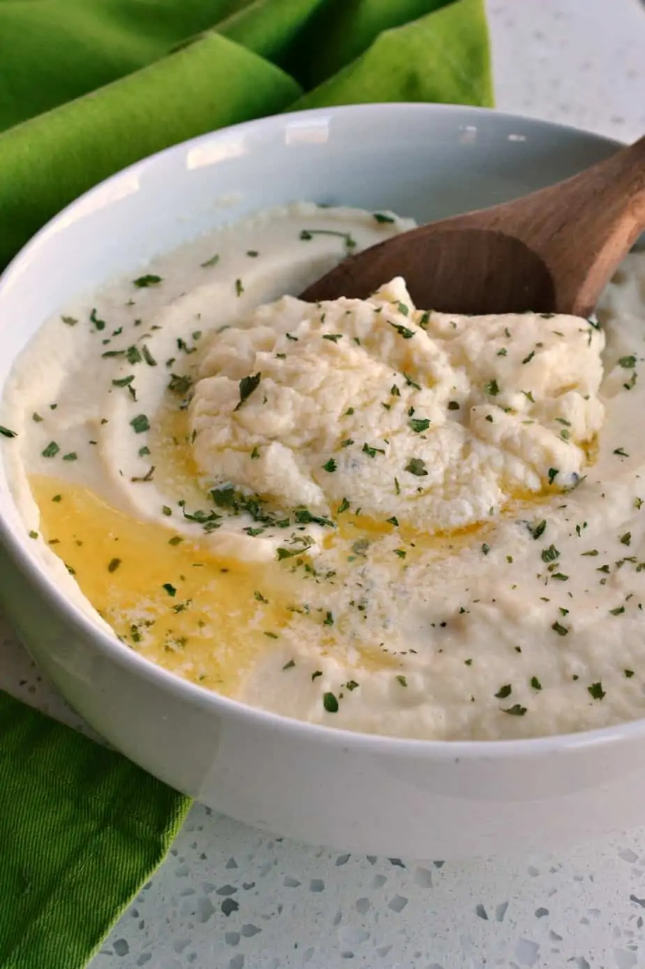 Delicious, easy and cheesy Mashed Cauliflower is a great low carb alternative to mashed potatoes. 