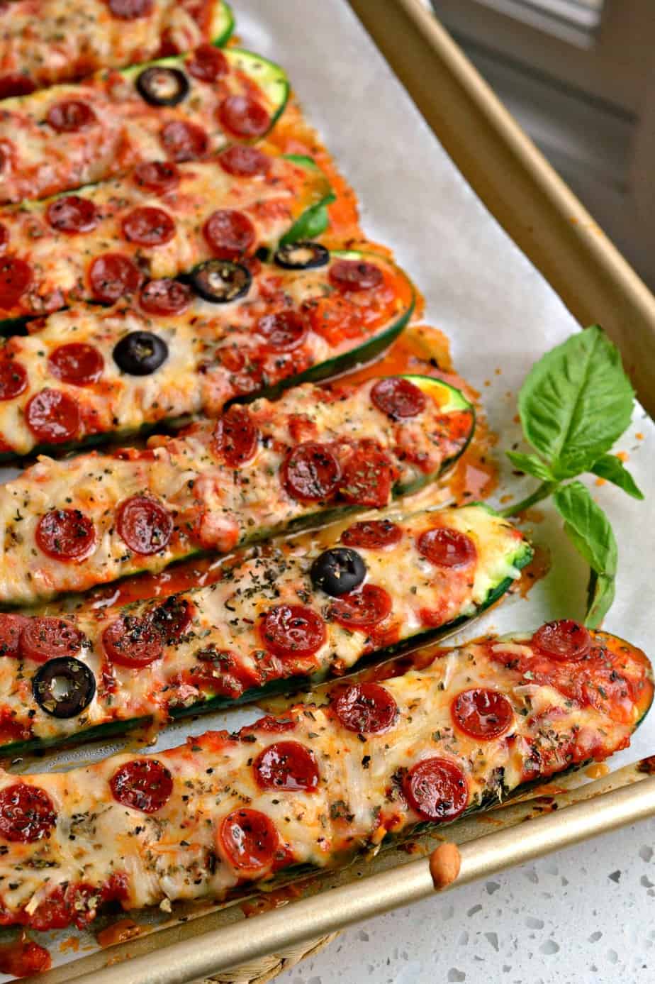 Easy to make Pizza Stuffed Zucchini Boats are flavor packed with marinara, garlic, mozzarella, provolone and mini pepperoni. 