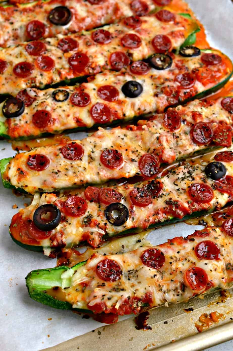Learn how to make fun and easy low carb Pizza Stuffed Zucchini Boats.