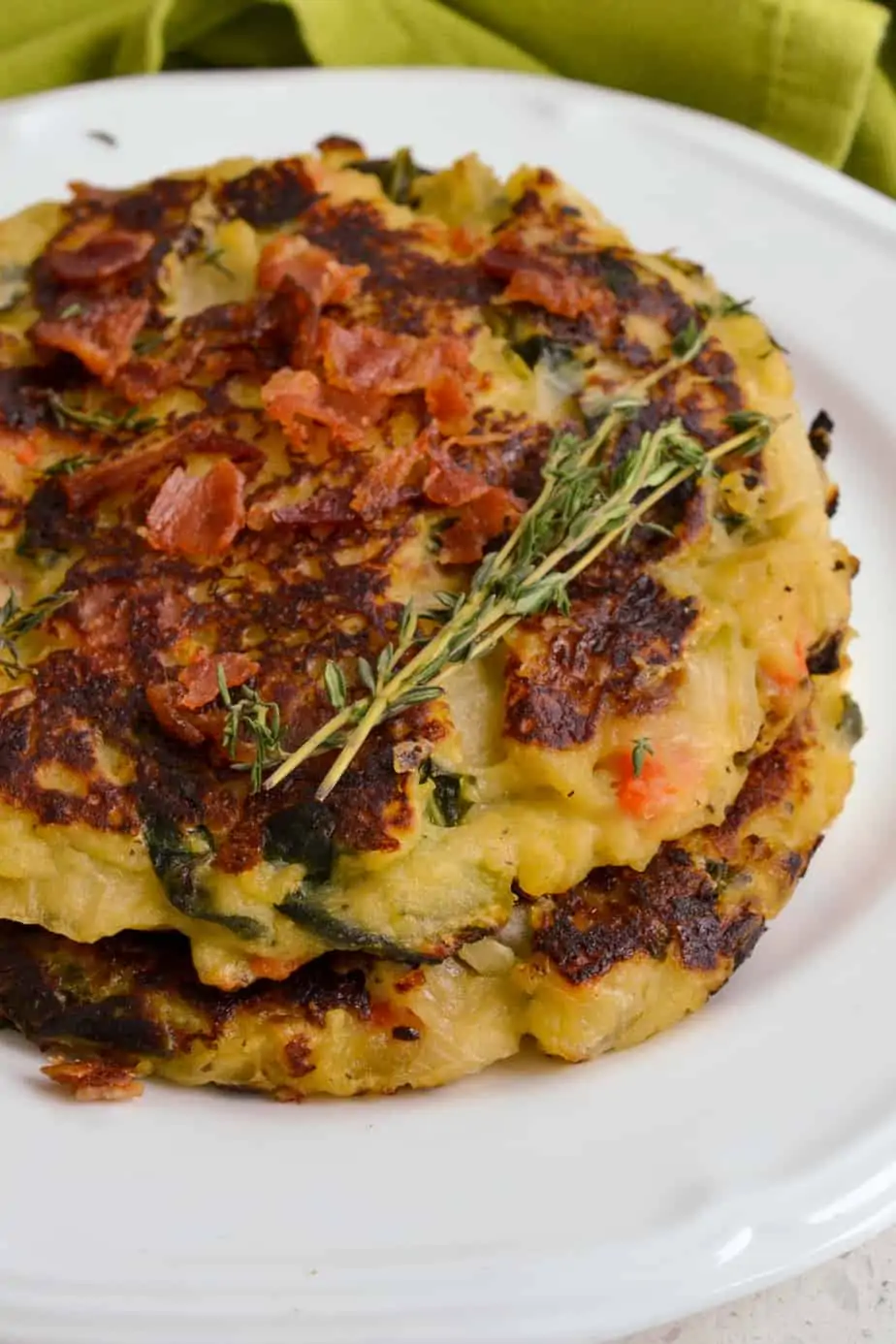 Mashed potato cakes made with leftover cooked veggies like carrots, cabbage, onions and kale. 