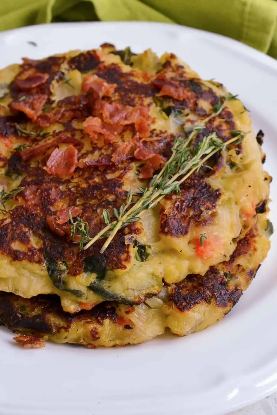 Delicious potato cakes made with cabbage, onions, carrots, collard greens and ham. 