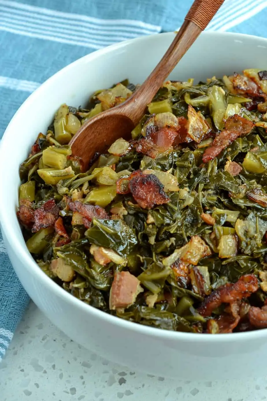 Southern greens slow cooked with bacon, onions, and garlic. 