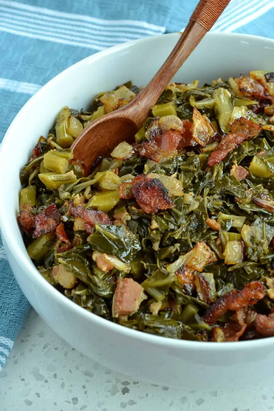 Southern greens slow cooked with bacon, onions, and garlic.