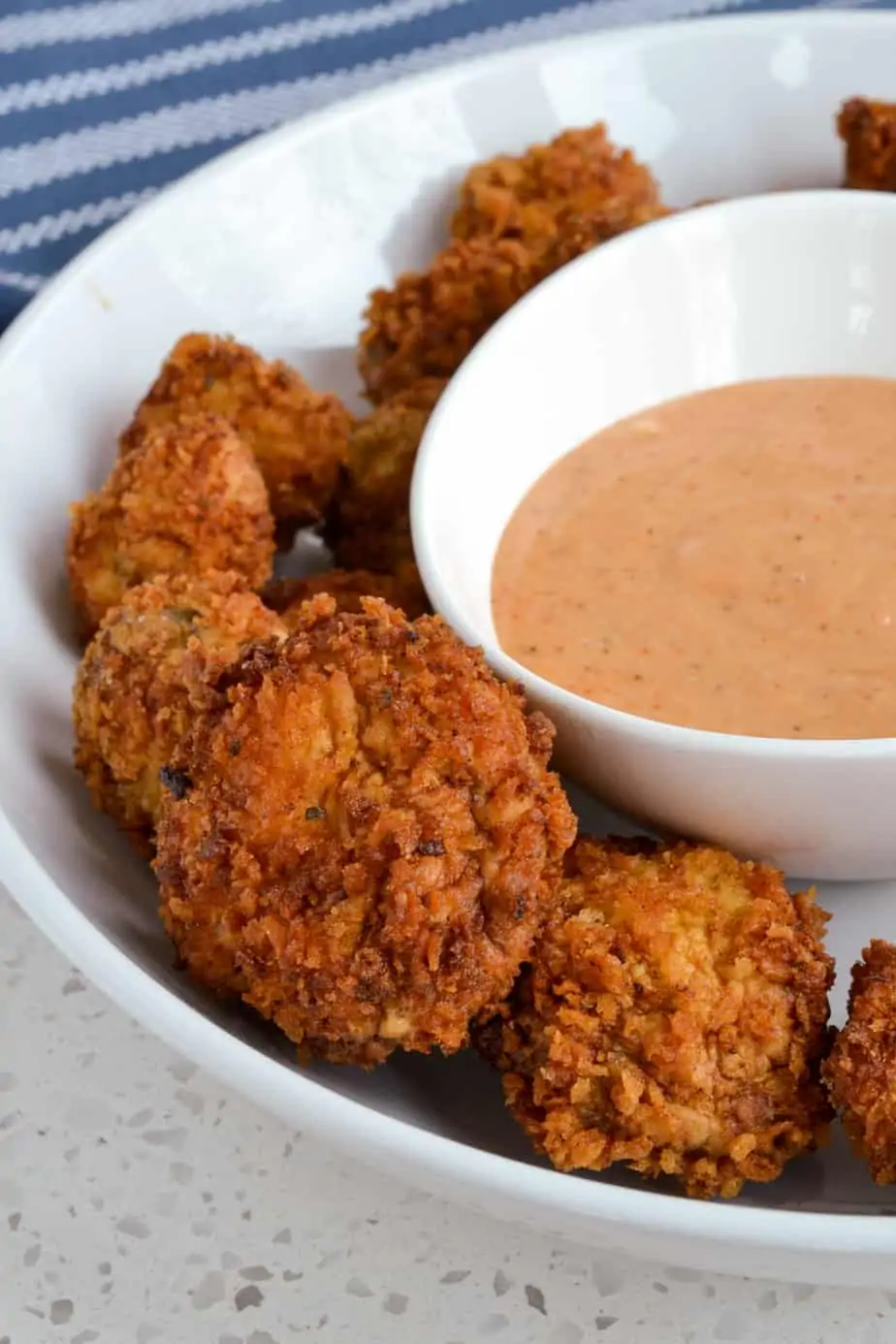 Crispy and slightly spicy fried white button mushrooms