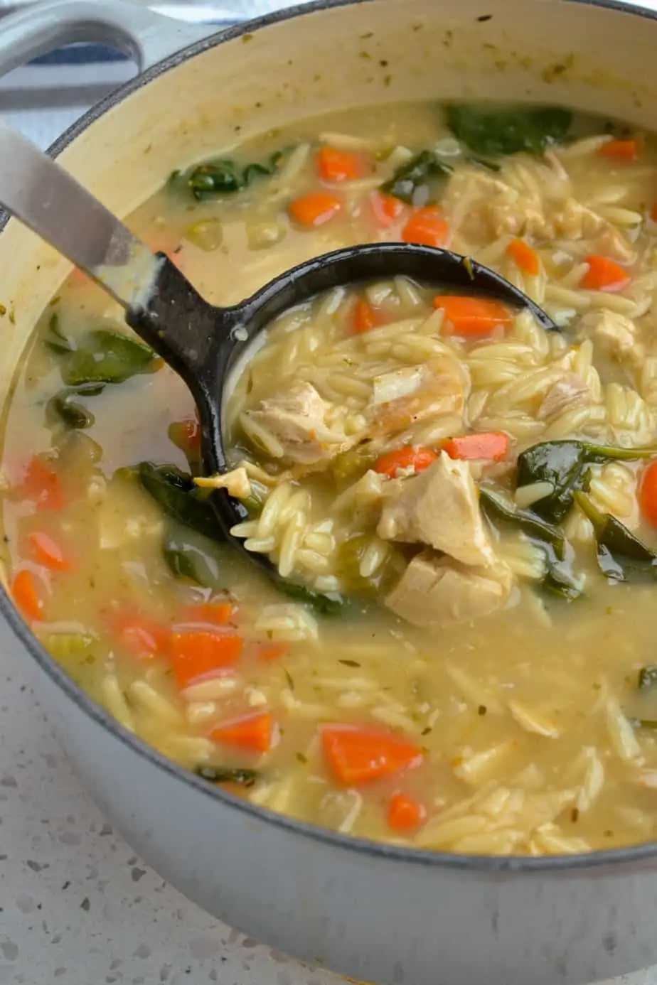 A quick and simple creamy chicken orzo soup with a touch of lemon