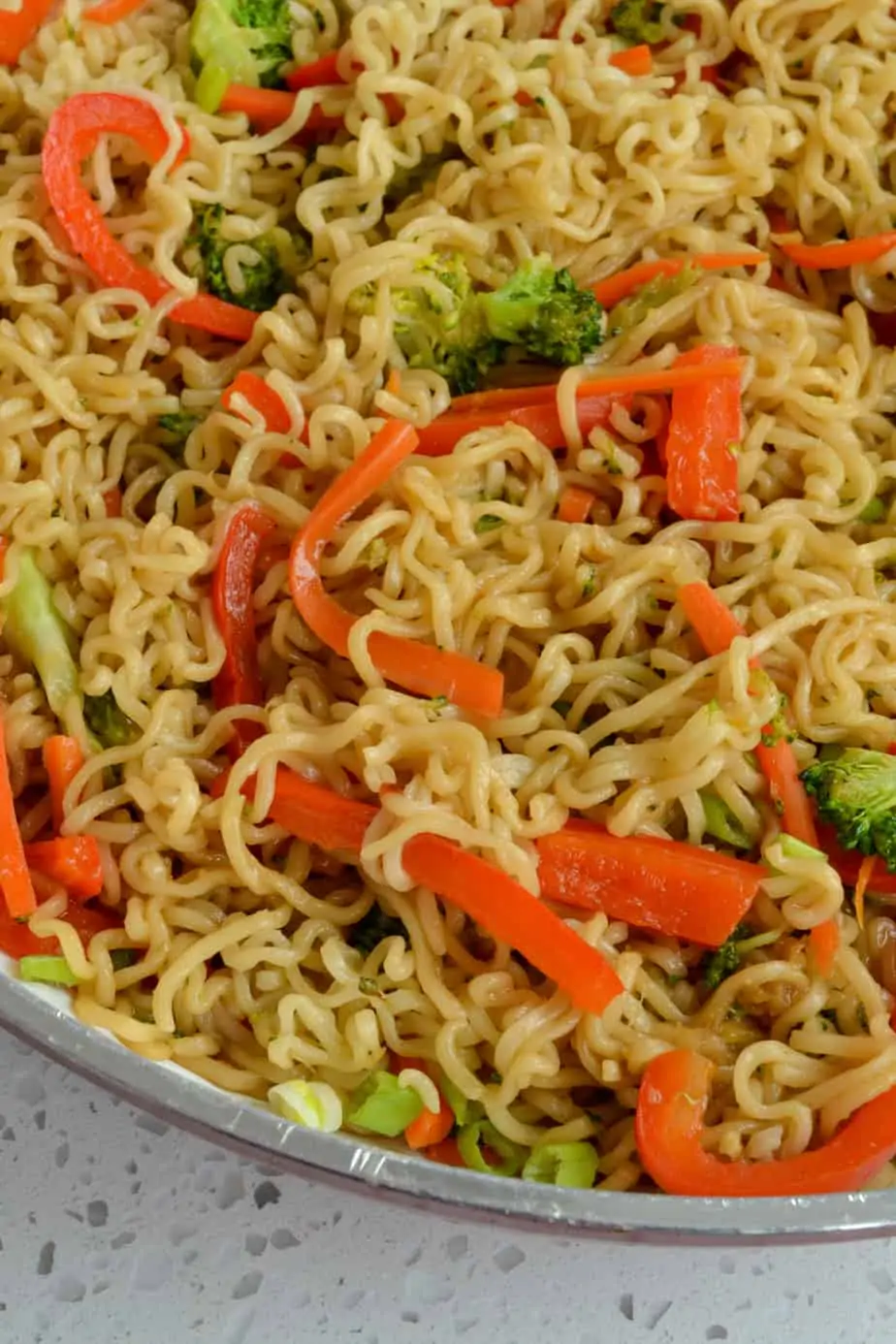 Ramen noodles combined with peppers, carrots and broccoli.