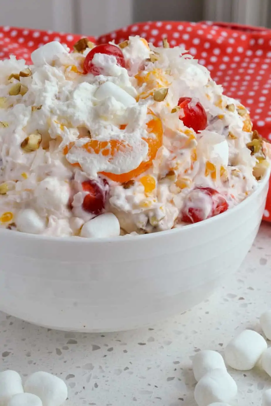 Creamy Ambrosia Salad with cherries, mandarin oranges, and pineapple. 