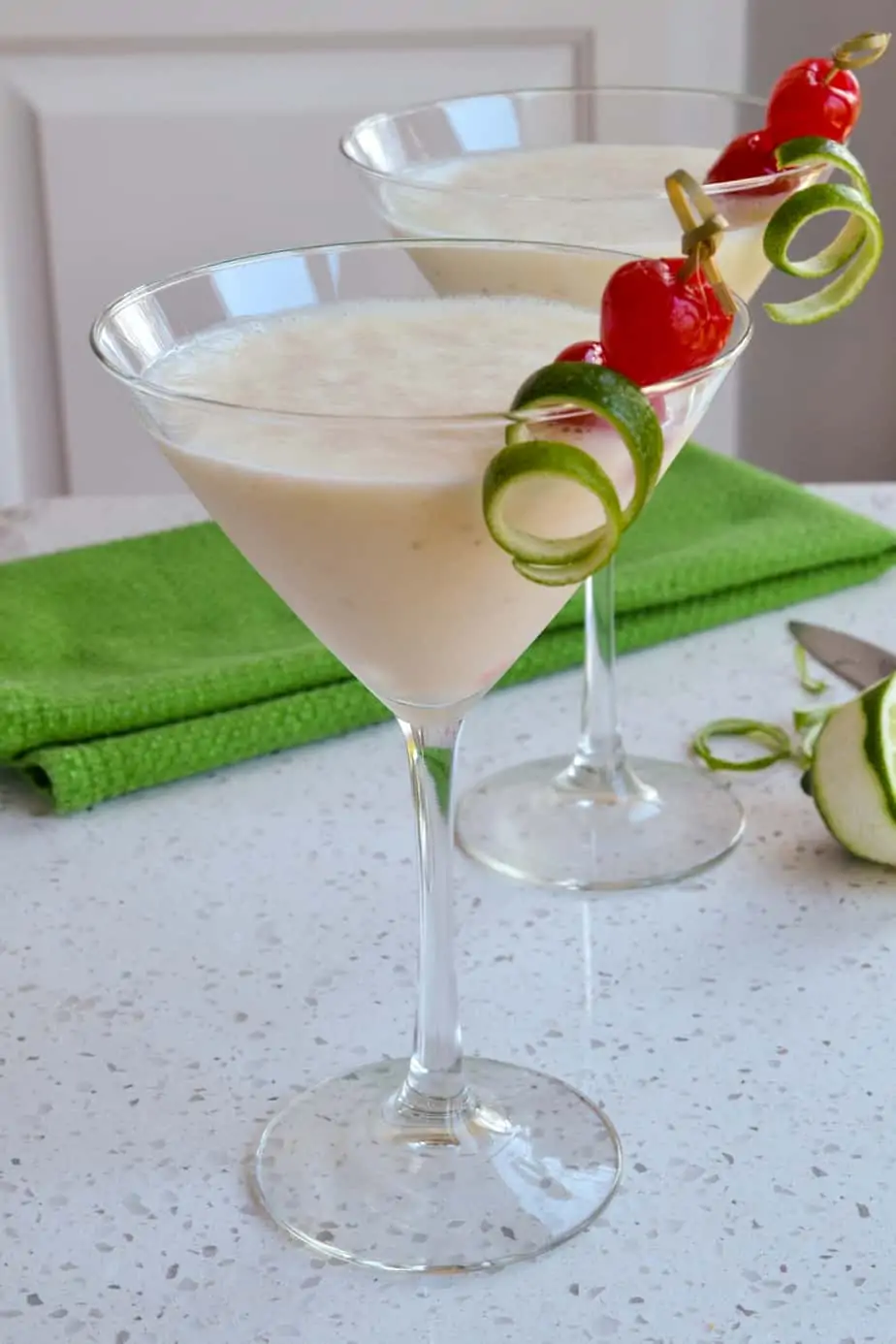 Rum, bananas, coconut milk, and ice are blended to make these cocktails. 