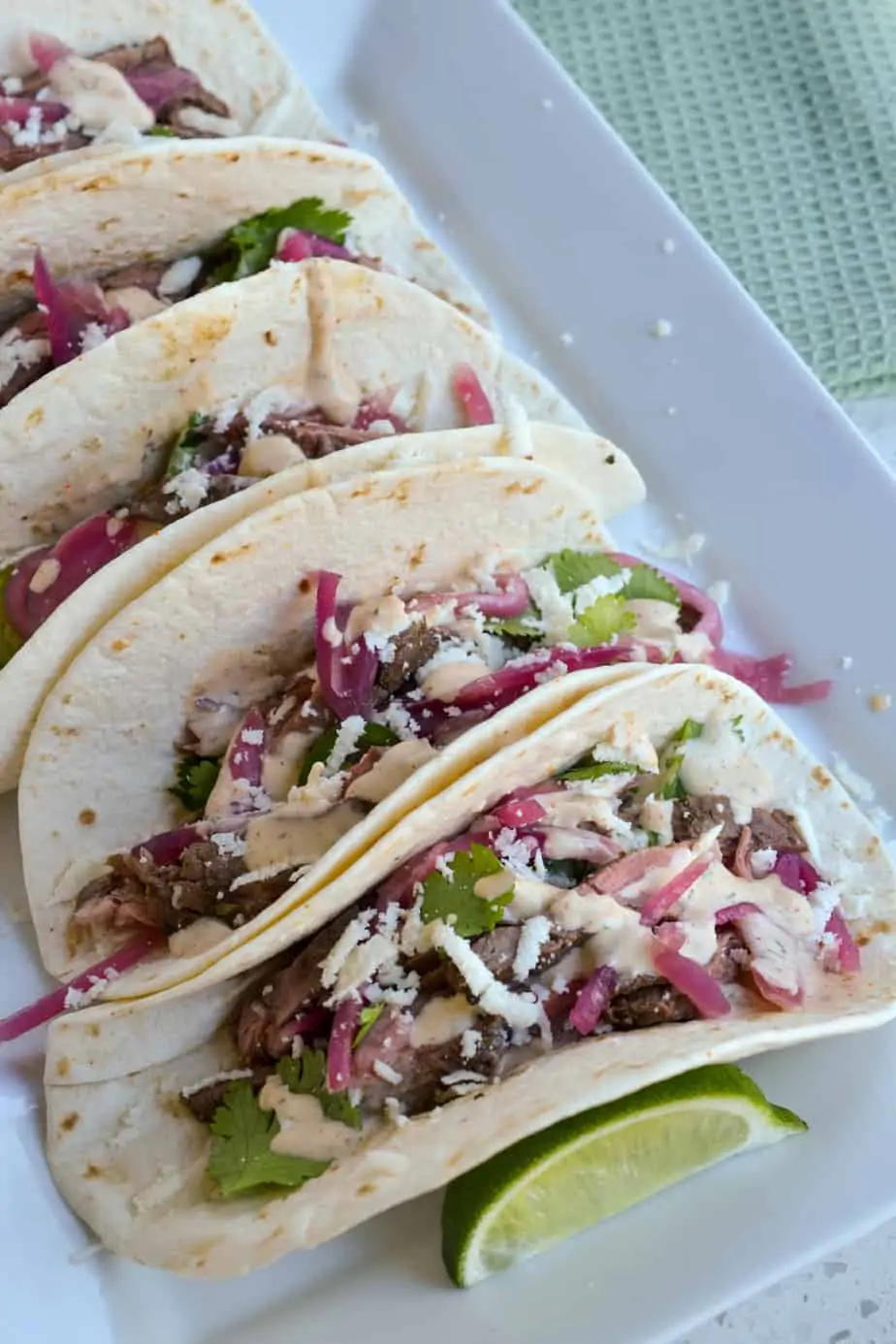 A plate of carne asada street tacos. 