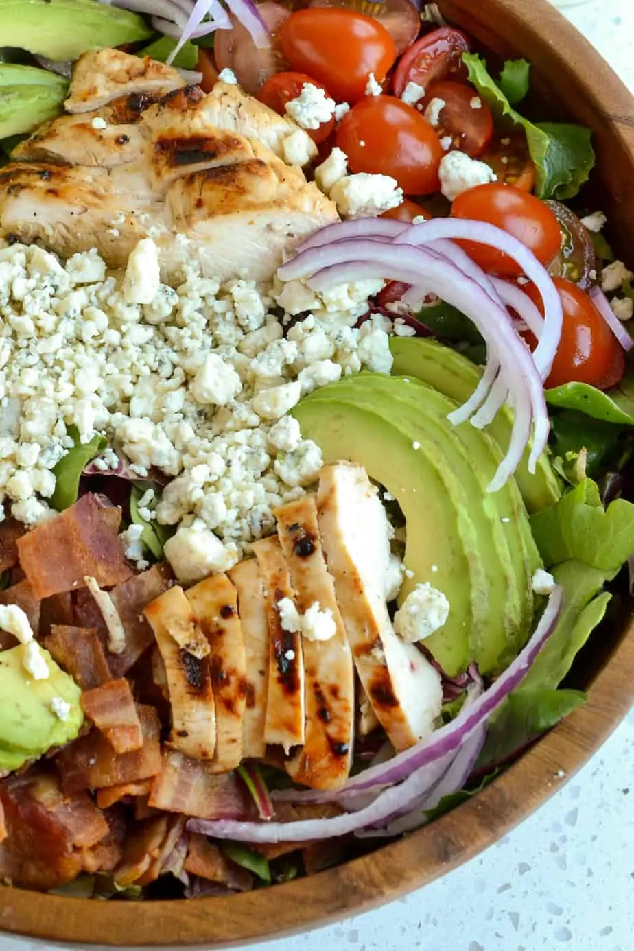 Fresh salad in a wooden bowl. 