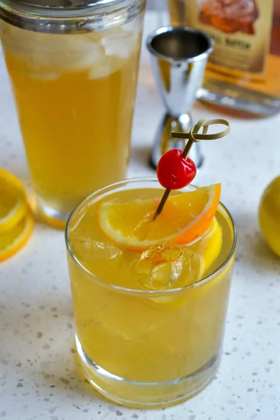 Bright lemon cocktail mixed in a cocktail shaker