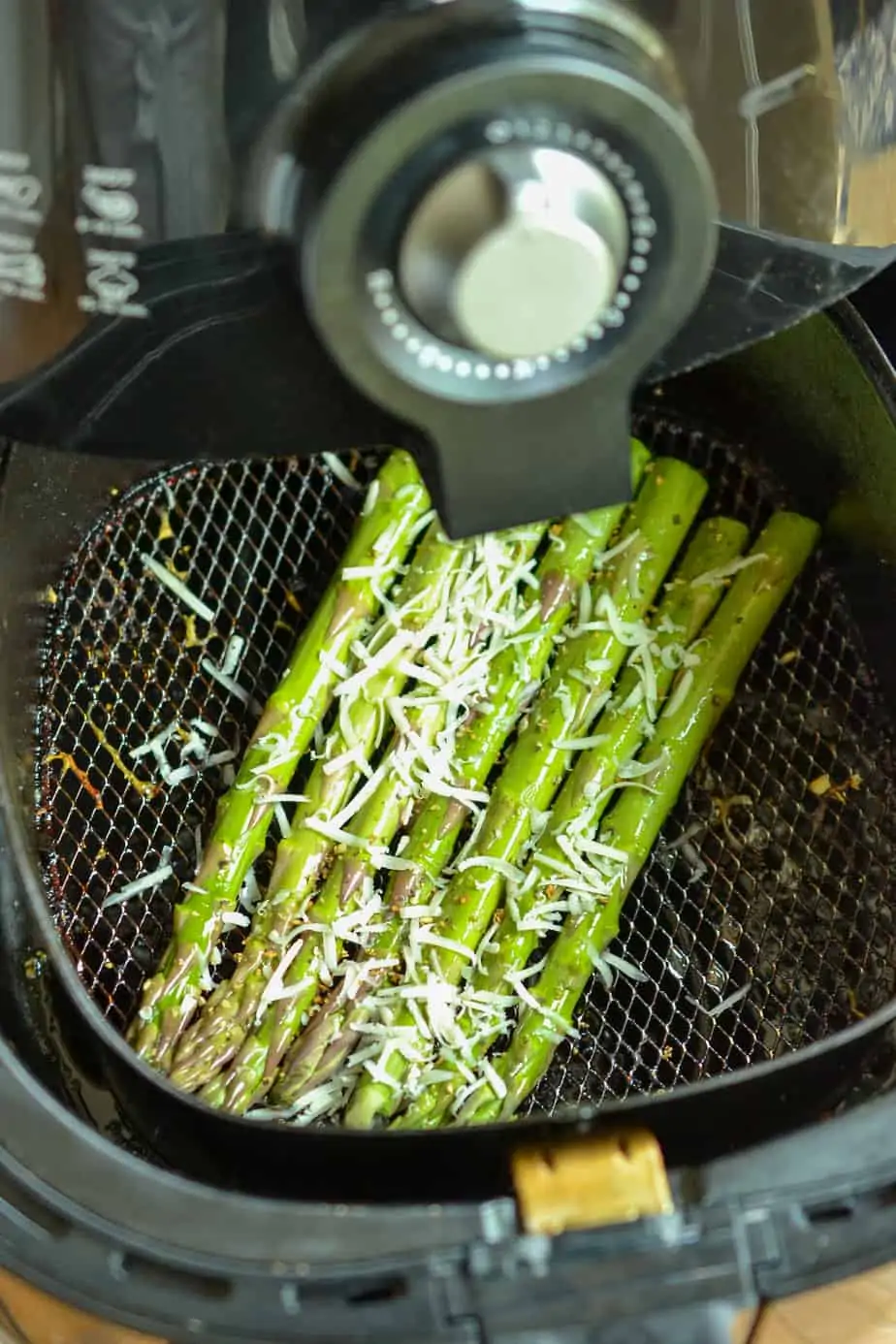 Lay the asparagus in a single layer in the basket of the air fryer. 