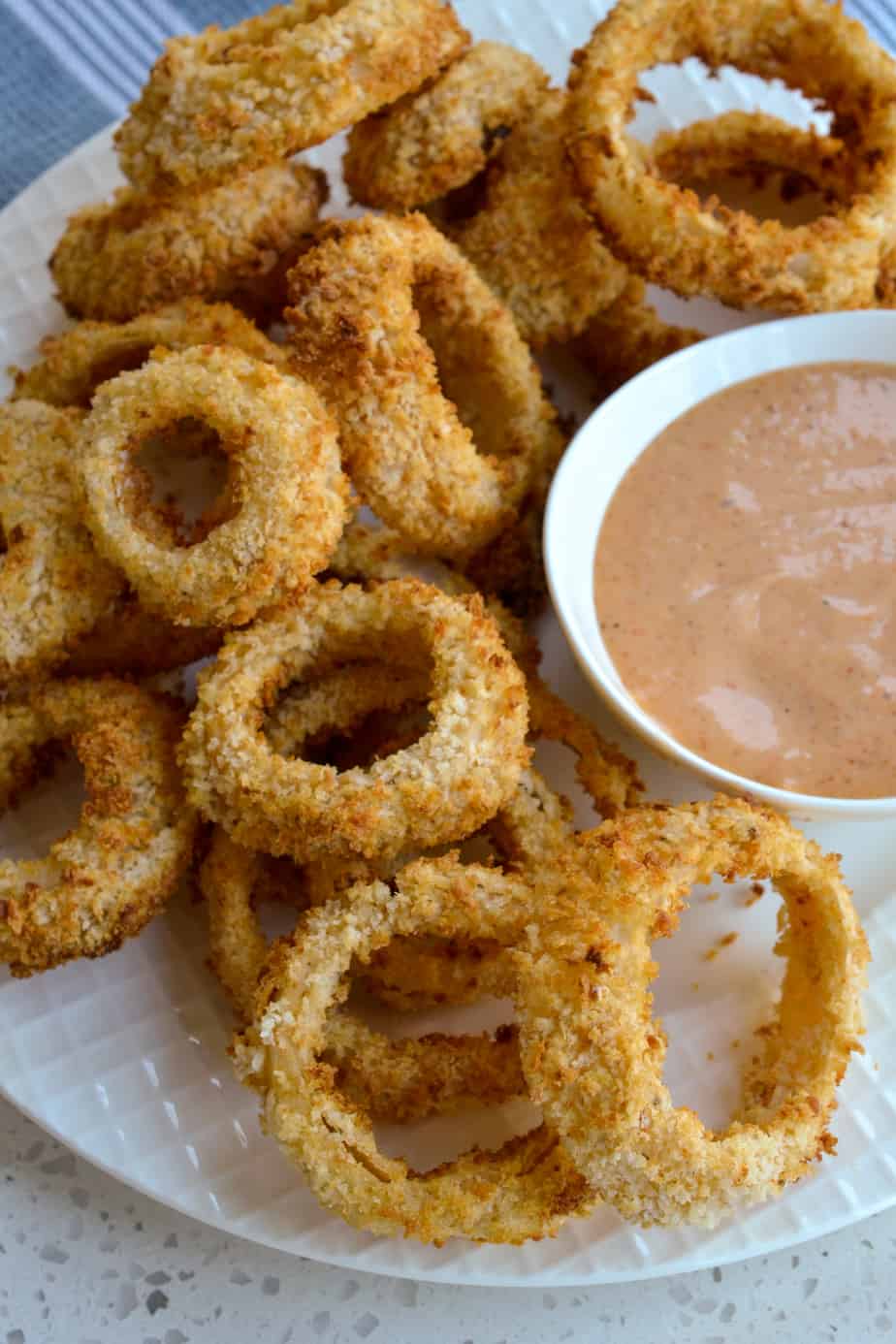 Homemade air fryer onion rings with dipping sauce. 