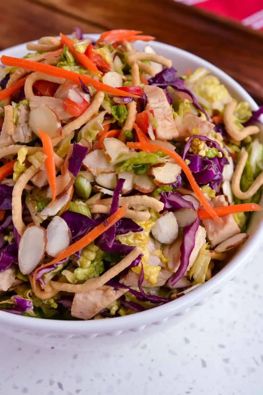 A bowl of Oriental Chicken Salad drizzled with an easy six ingredient Asian Dressing. 