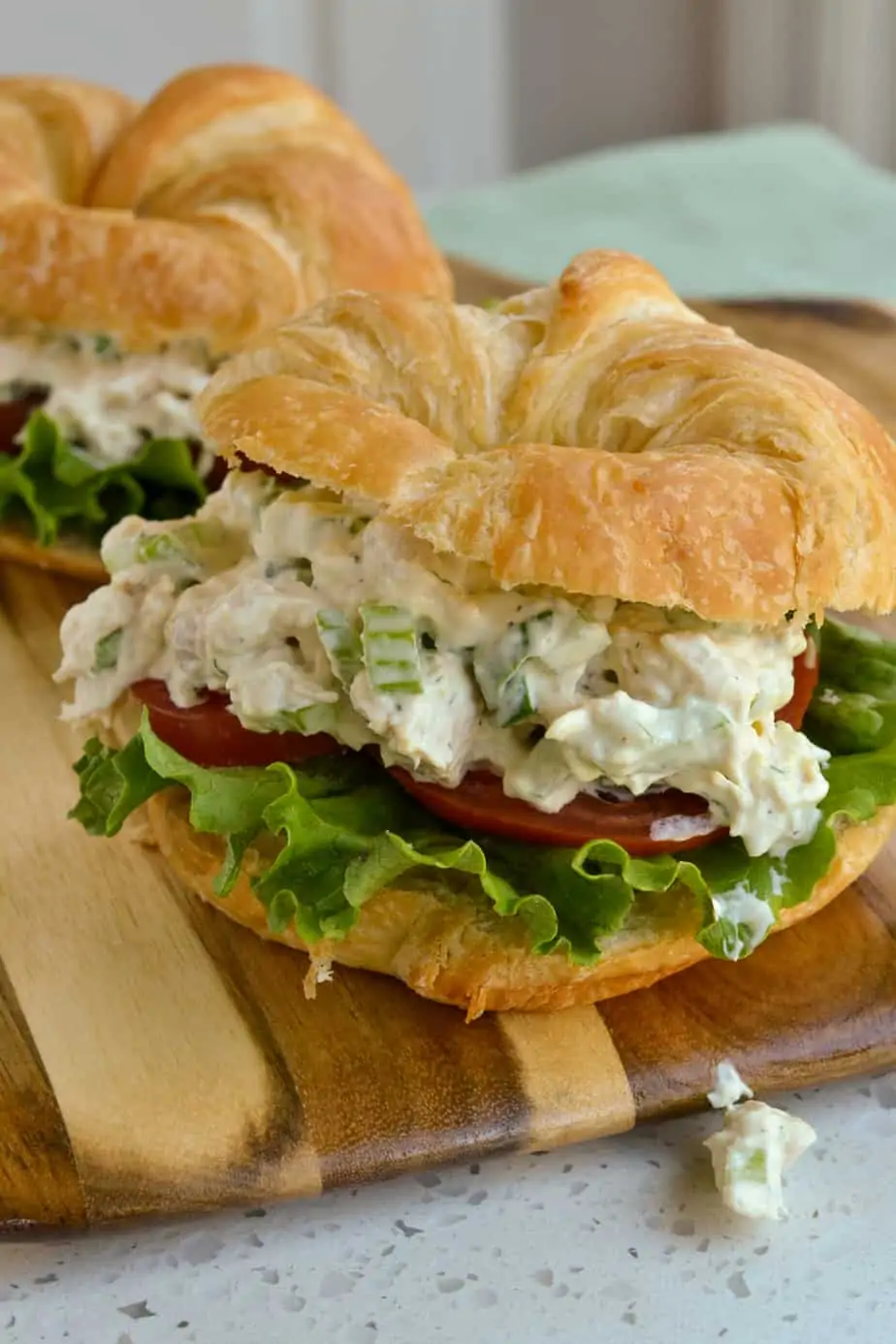 Rotisserie Chicken Salad on a croissant with lettuce and tomato. 