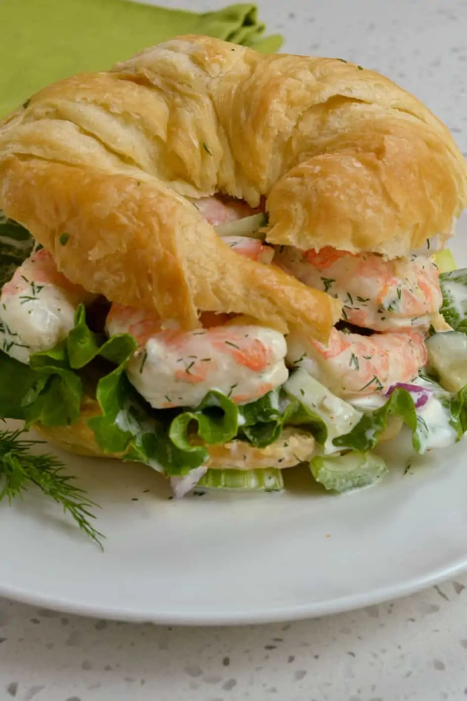 Shrimp salad on buttery croissant. 