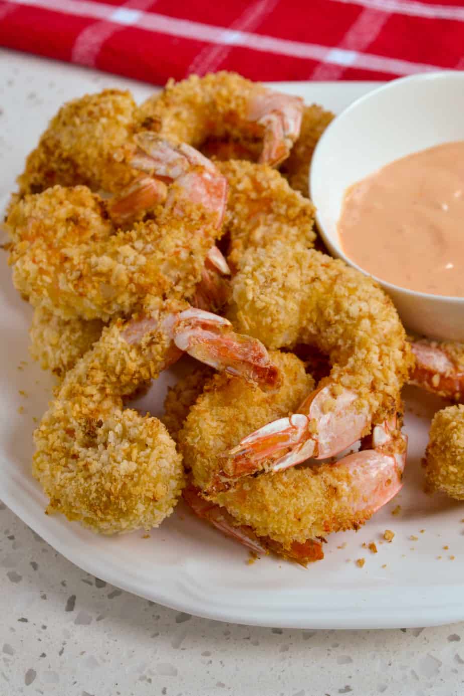 Crisp air fryer shrimp on a plate. 