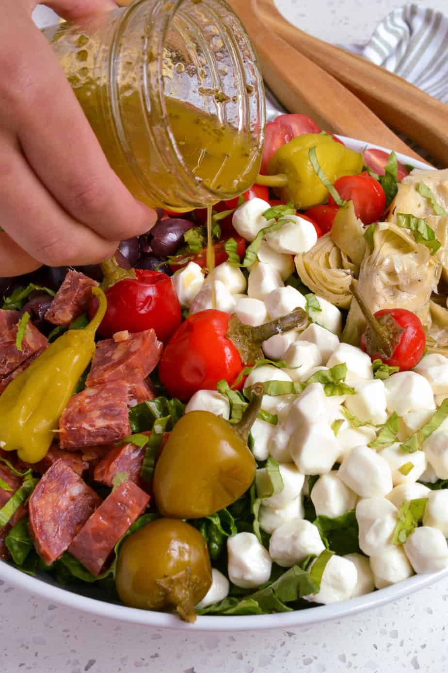 Oil and vinegar Italian salad dressing drizzled over a fresh antipasto salad. 