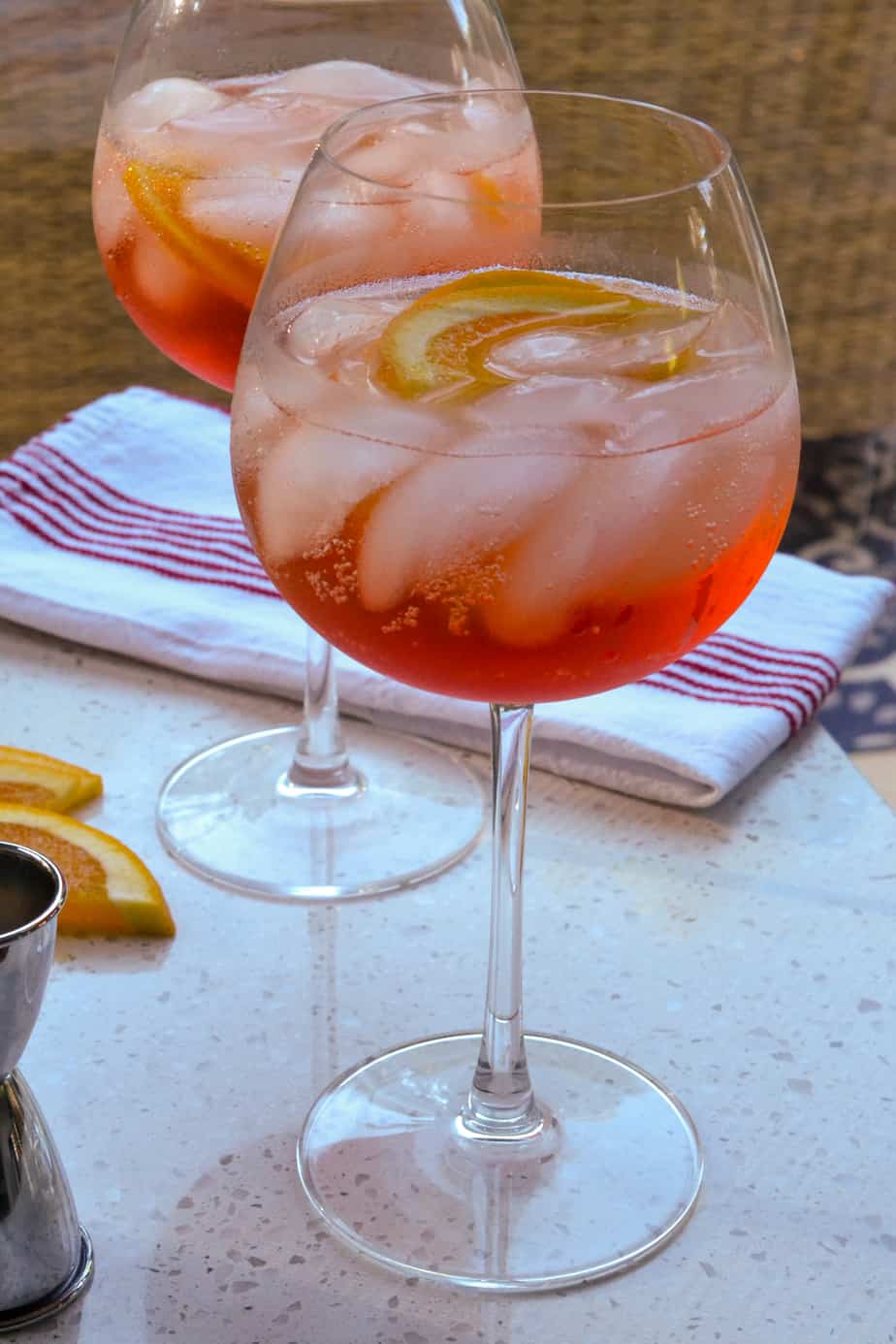 Two glasses filled with Aperol spritz. 