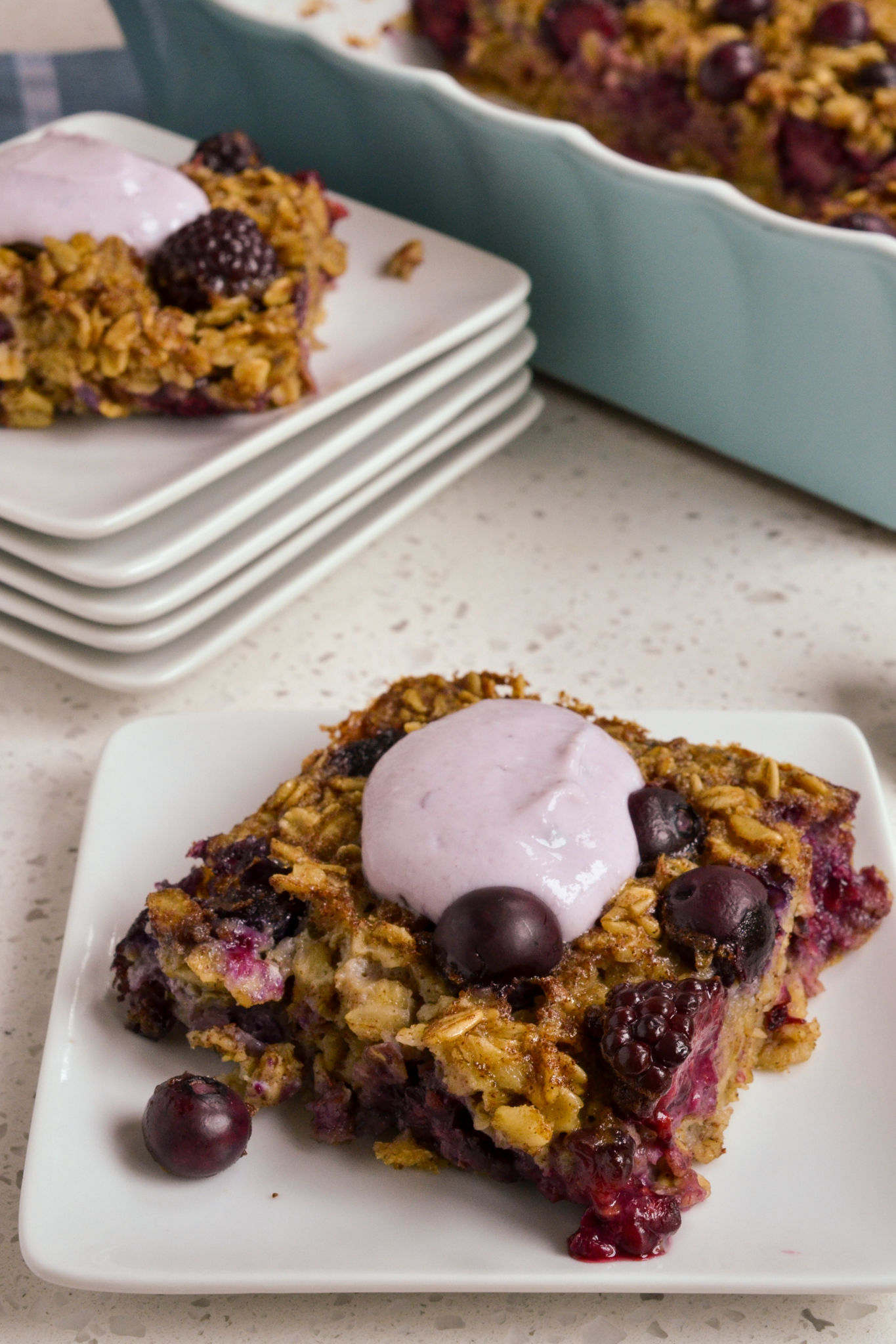 A slice of baked oatmeal with yogurt. 