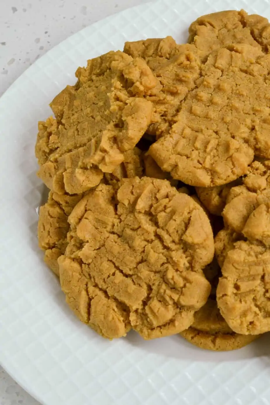A plate full of peanut butter cookies