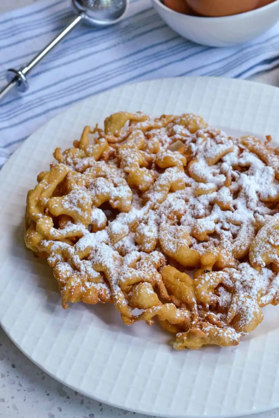 Funnel cake with powdered sugar. 