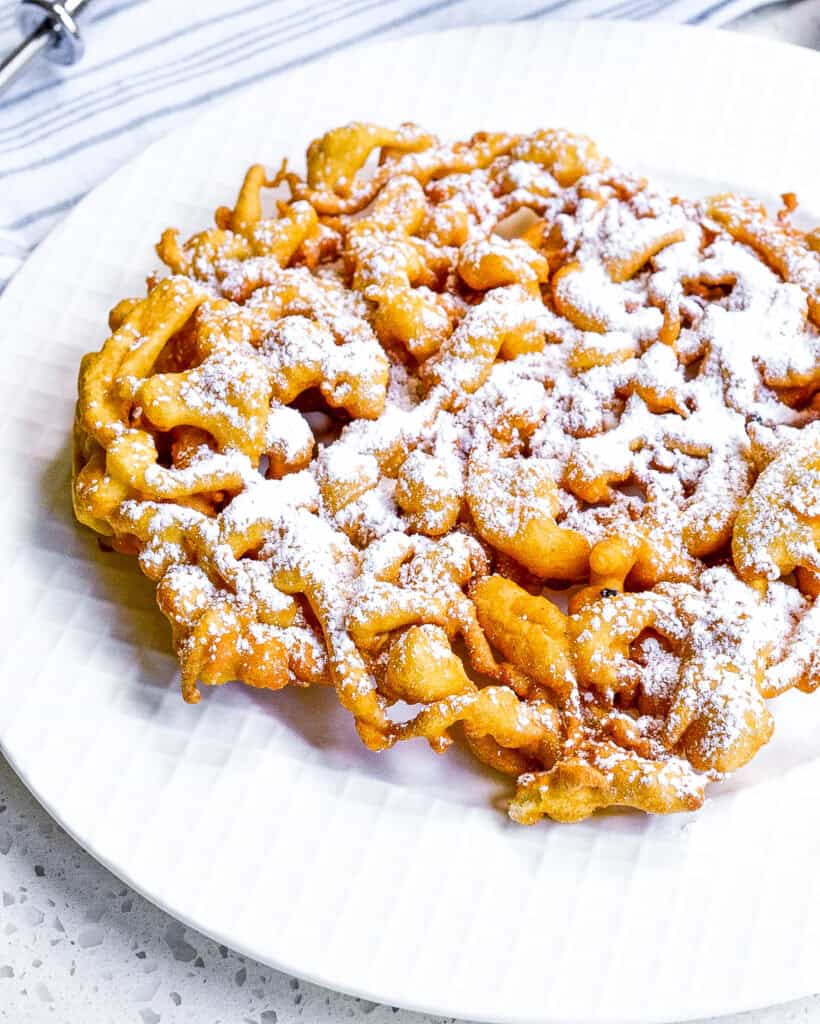 These scrumptious Funnel Cakes are so easy to make. You can bring the carnival home to your kitchen anytime. 