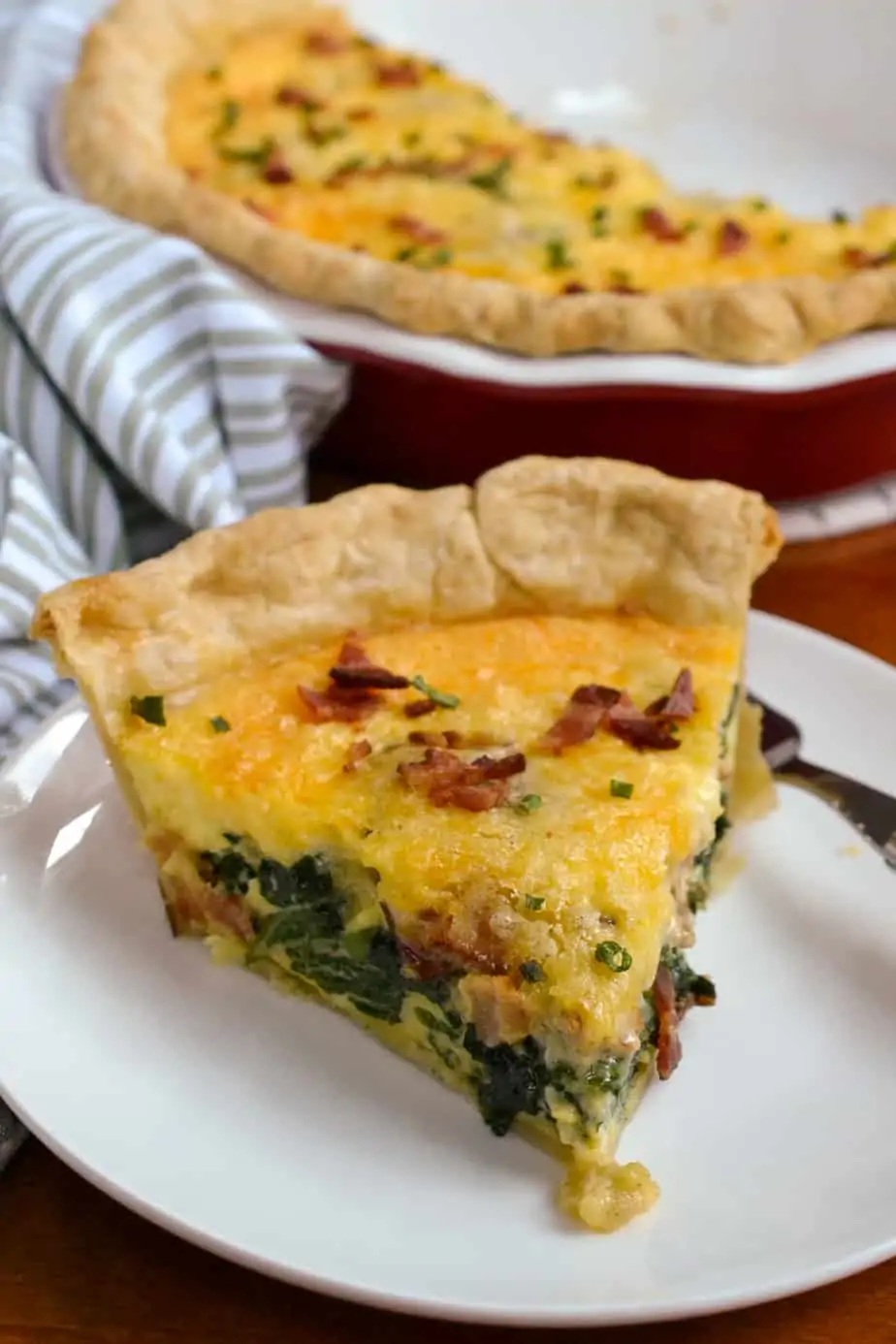 A slice of homemade spinach quiche. 