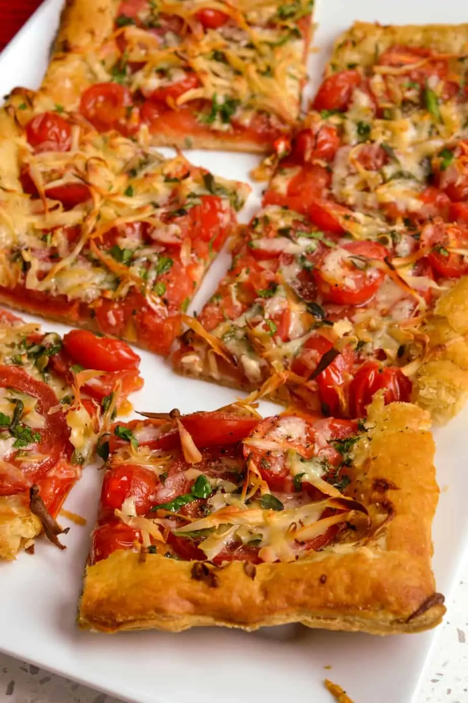 This delicious tomato tart dish takes just a few minutes to assemble, looks gorgeous, and tastes better than any five-star restaurant.