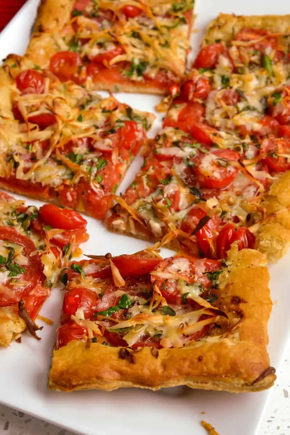 Sliced tomato tart with fresh herbs