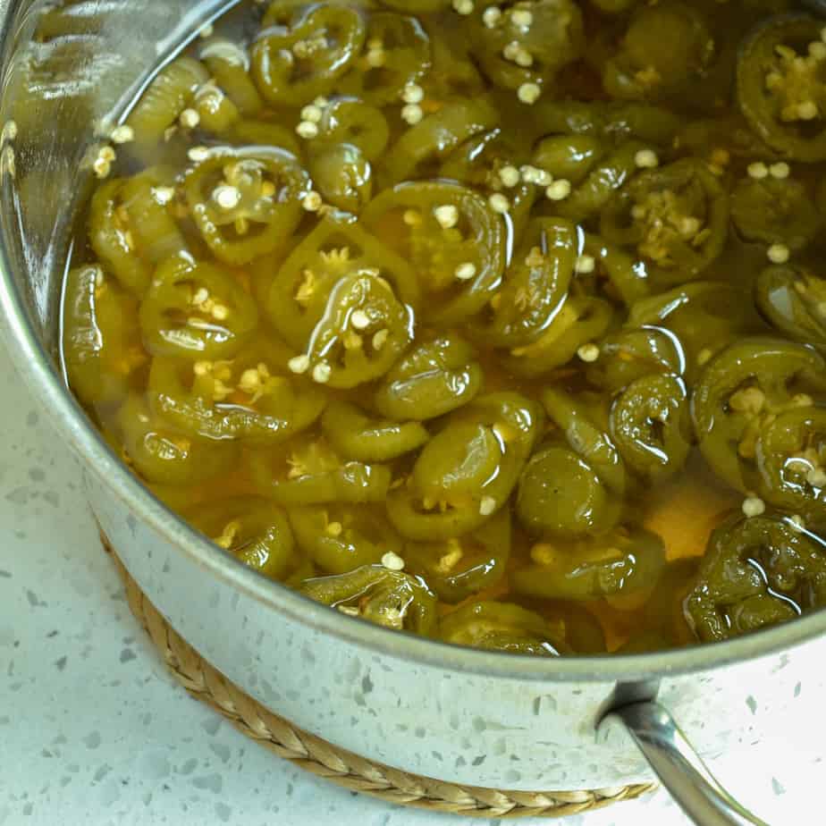 A large pot of candied jalapenos. 