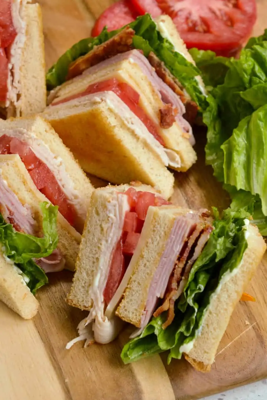 A triple layer classic club sandwich with bacon