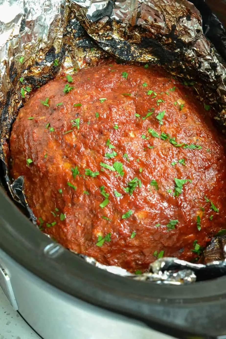 Glazed meatloaf cooked in a slow cooker. 