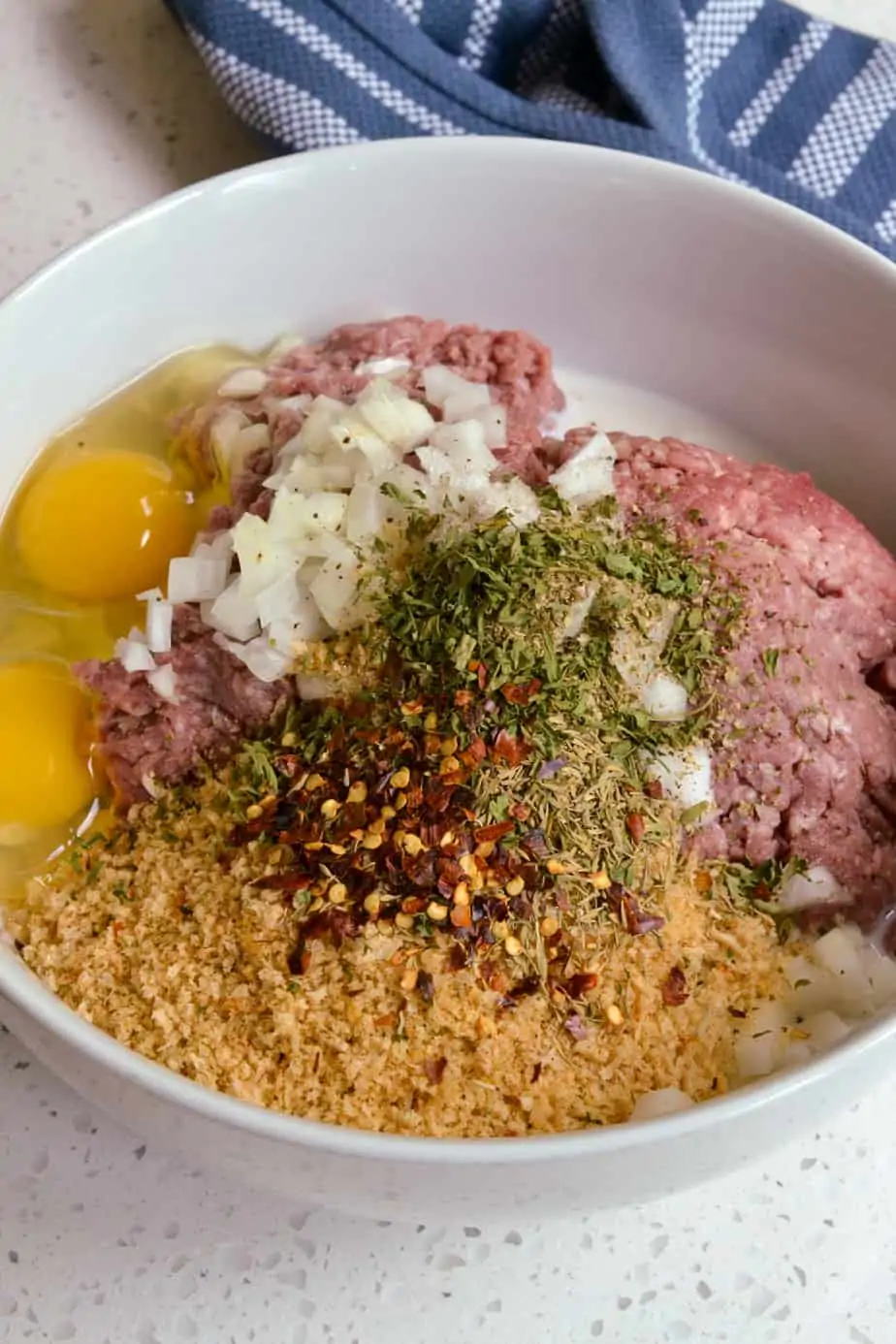 The ingredients for meatloaf in a bowl. 