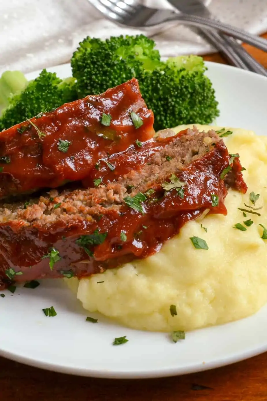 Crock pot meatloaf on mashed potatoes with broccoli on the side. 