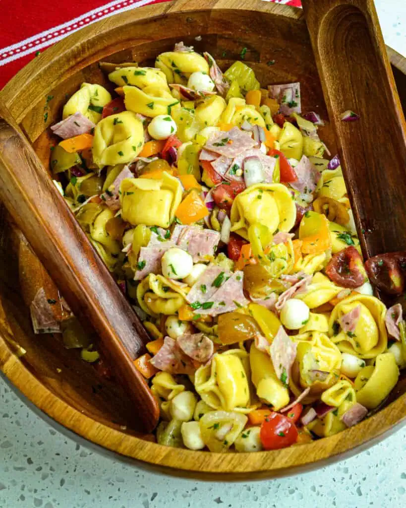 Impress your friends and family with this easy and flavorful tortellini pasta salad recipe. Learn the simple steps to make this crowd-pleasing dish at home!