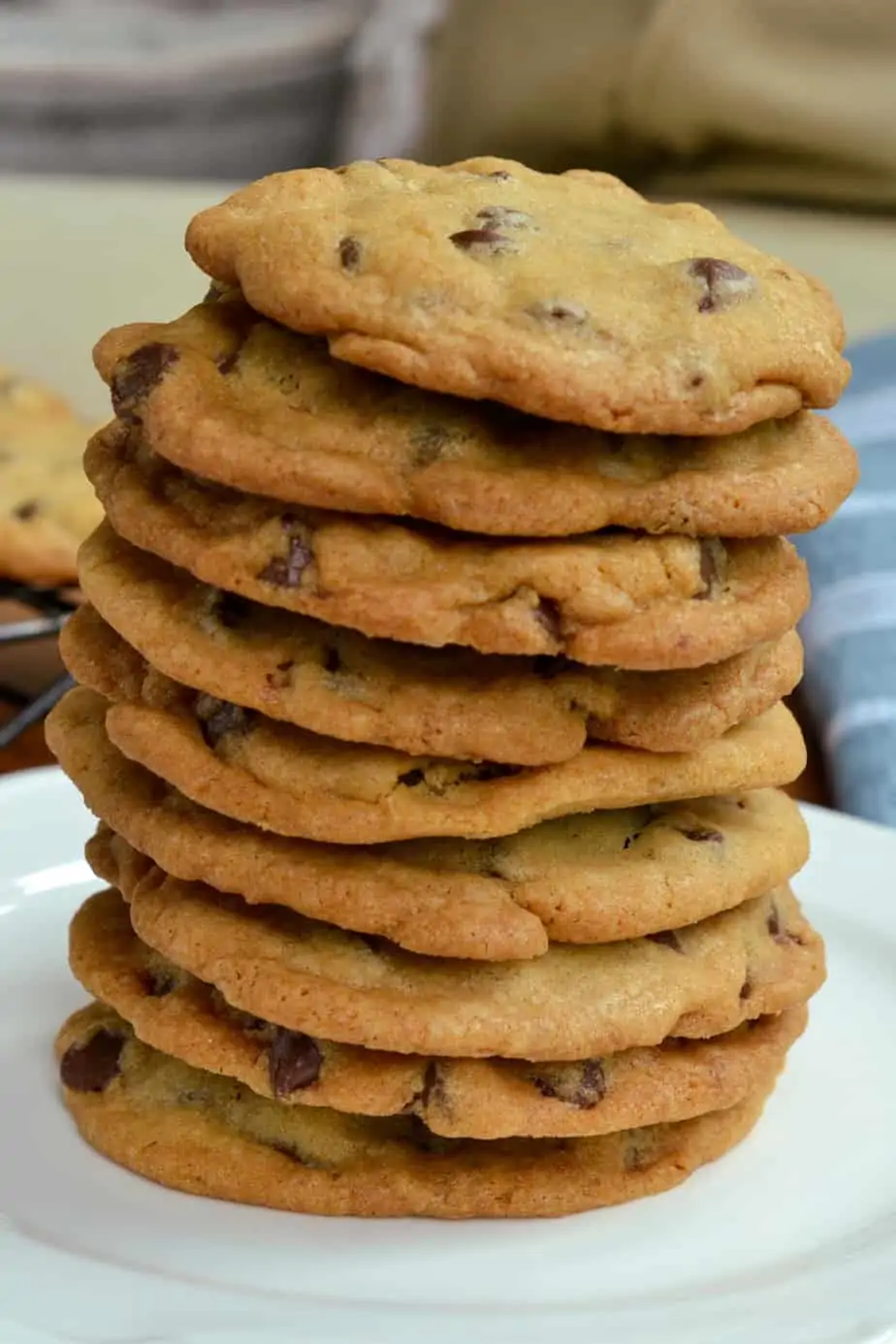 A stack of thin crispy chocolate chip cookies