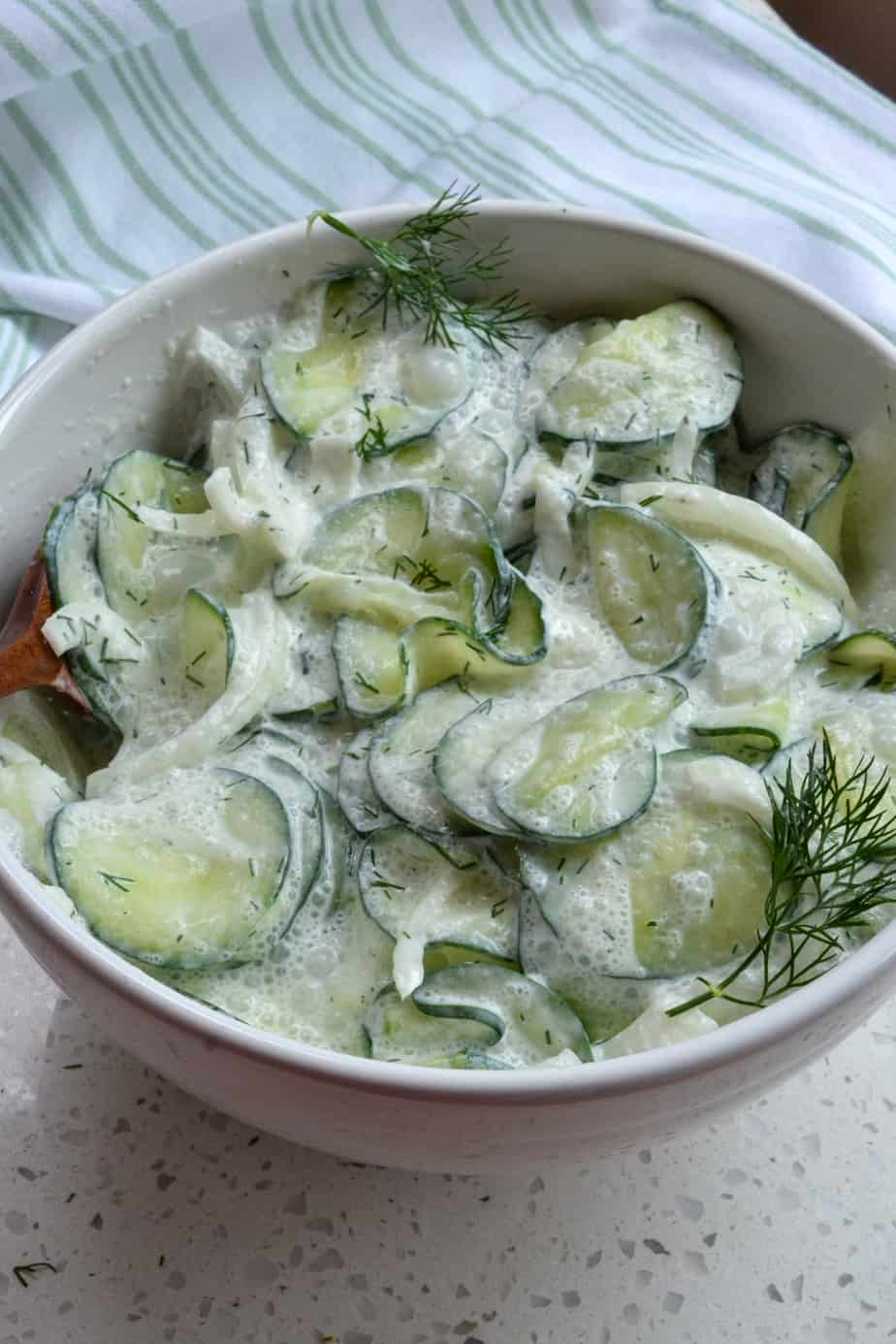 Quick and easy sour cream and dill based cucumber salad. 