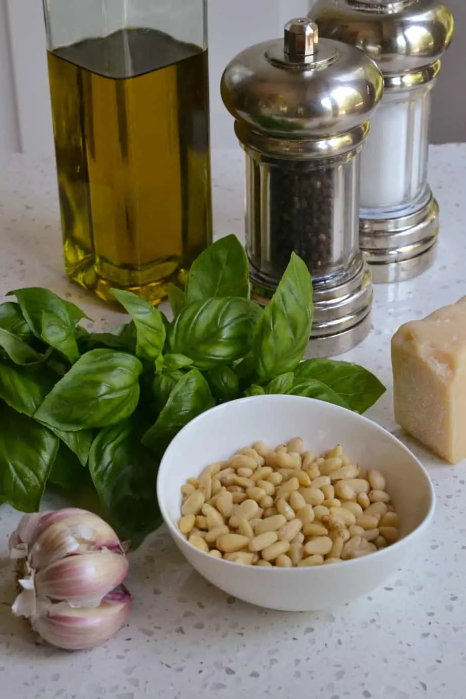 Pesto sauce is made with pine nuts, basil, garlic, Parmesan Cheese, and olive oil. 